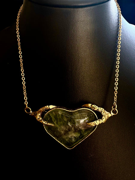 Crow Claw holding Rutilated quartz Heart